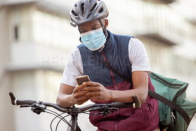 Buy stock photo Courier service, delivery and black man with phone, shipping app with face mask for Covid compliance. Eco friendly travel, outdoor and communication with ecommerce and bike, retail and distribution