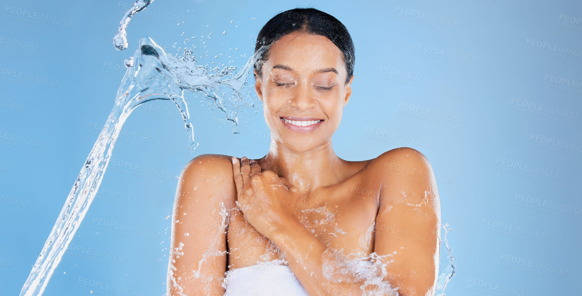 Buy stock photo Happy beauty model, water splash or showering in skincare grooming, healthcare or sustainability cleaning on isolated blue background. Zoom, smile or black woman in wet drops or hydration dermatology