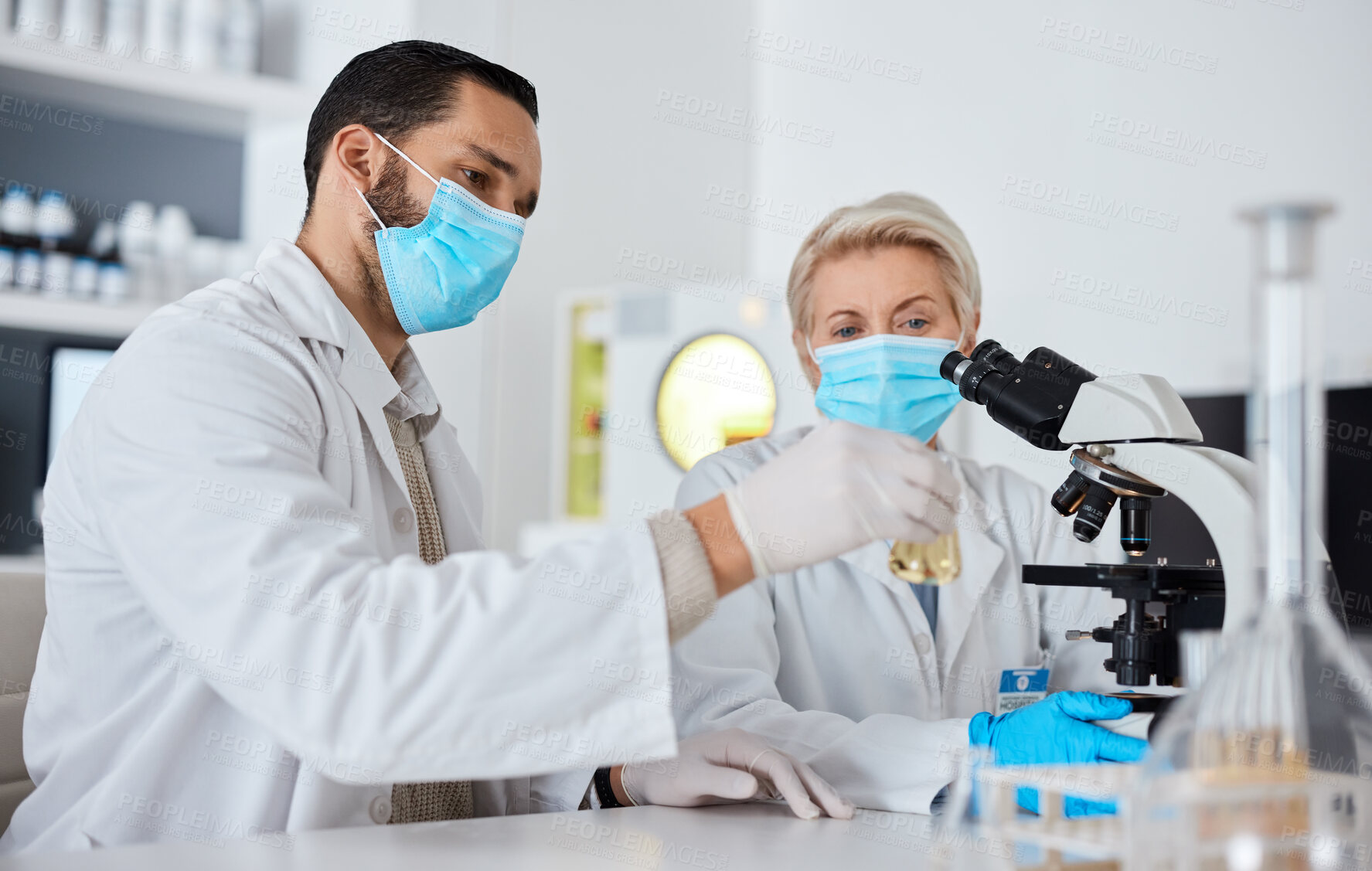 Buy stock photo Research, glass beaker and scientists working in laboratory for medical cure or vaccine. Innovation, teamwork and team of professional scientific experts with face mask in pharmaceutical science lab.