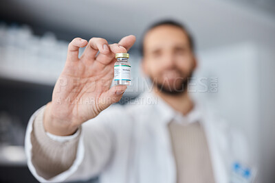 Buy stock photo Vaccine, hand and healthcare with a doctor man holding a bottle of monkeypox treatment in a hospital. Medical, research and innovation with a container of vaccination treatment in a medicine clinic