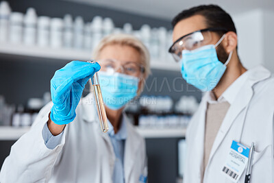Buy stock photo Medical science, test tube and team in laboratory with face mask or ppe for research or analysis. Man and woman scientist or doctor hand for futuristic chemical or medicine innovation or development
