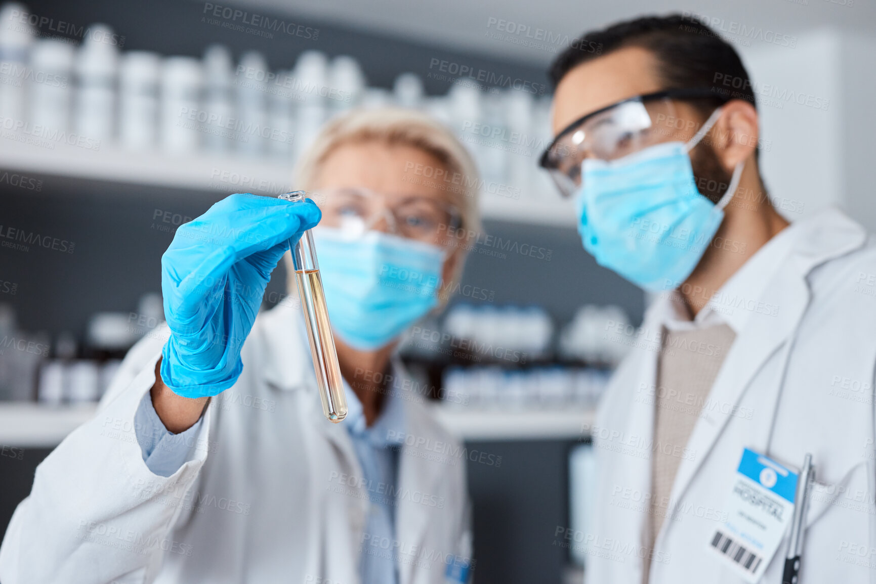 Buy stock photo Medical science, test tube and team in laboratory with face mask or ppe for research or analysis. Man and woman scientist or doctor hand for futuristic chemical or medicine innovation or development