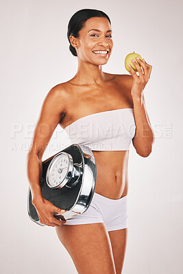 Buy stock photo Portrait, apple or woman with a scale in studio for a healthy snack, nutrition diet or digestion benefits. Body goals, lose weight or happy fitness model eating fruits isolated by a white background
