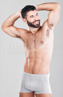 Buy stock photo Strong man, body and fitness with underwear for exercise, weight loss and wellness on studio background. Happy aesthetic person for health, motivation and stomach or muscle growth on healthy diet