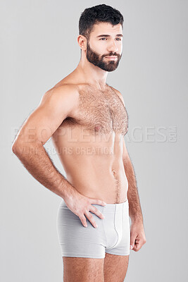 Buy stock photo Exercise, body and underwear with a man model in studio on a gray background for health or grooming. Aesthetic, muscle and manly with a handsome young male posing to promote wellness or lifestyle