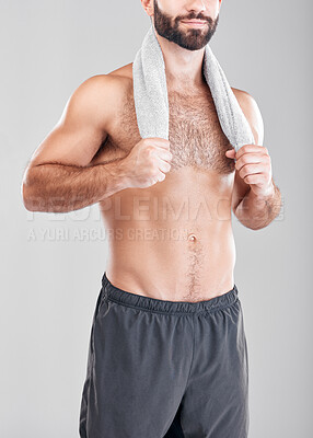 Buy stock photo Fitness, man and model with a towel from morning shower after training or exercise. Health body, male and athlete in isolated gray background in a studio ready for skincare, hygiene and body care 