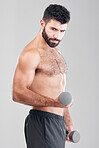 Man, fitness and exercise with dumbbells in studio isolated on a gray background. Sports thinking, training and male bodybuilder with strong muscles weight lifting, workout or bodybuilding for power.