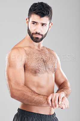 Buy stock photo Fitness, body and man flexing his muscles in a studio after a workout or bodybuilding training. Sports, motivation and sexy muscular male model posing after exercise while isolated by gray background