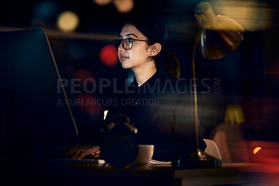 Buy stock photo Serious, woman and night business on computer for planning, research or strategy in office. Female working overtime on desktop technology, online or network of internet analytics, seo vision or focus