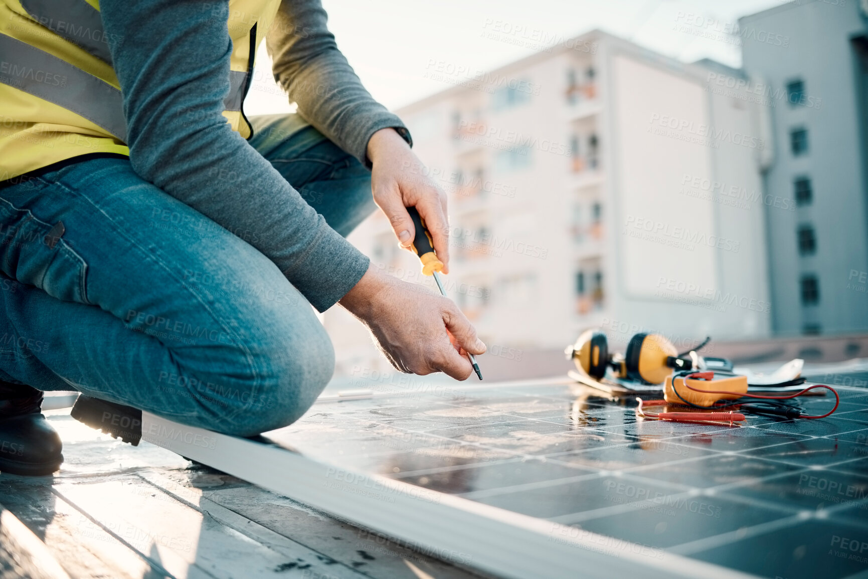 Buy stock photo Solar panel, city and construction worker hands with tools for renewable energy and electricity. Community innovation, roof work and engineering employ install eco friendly and sustainability product