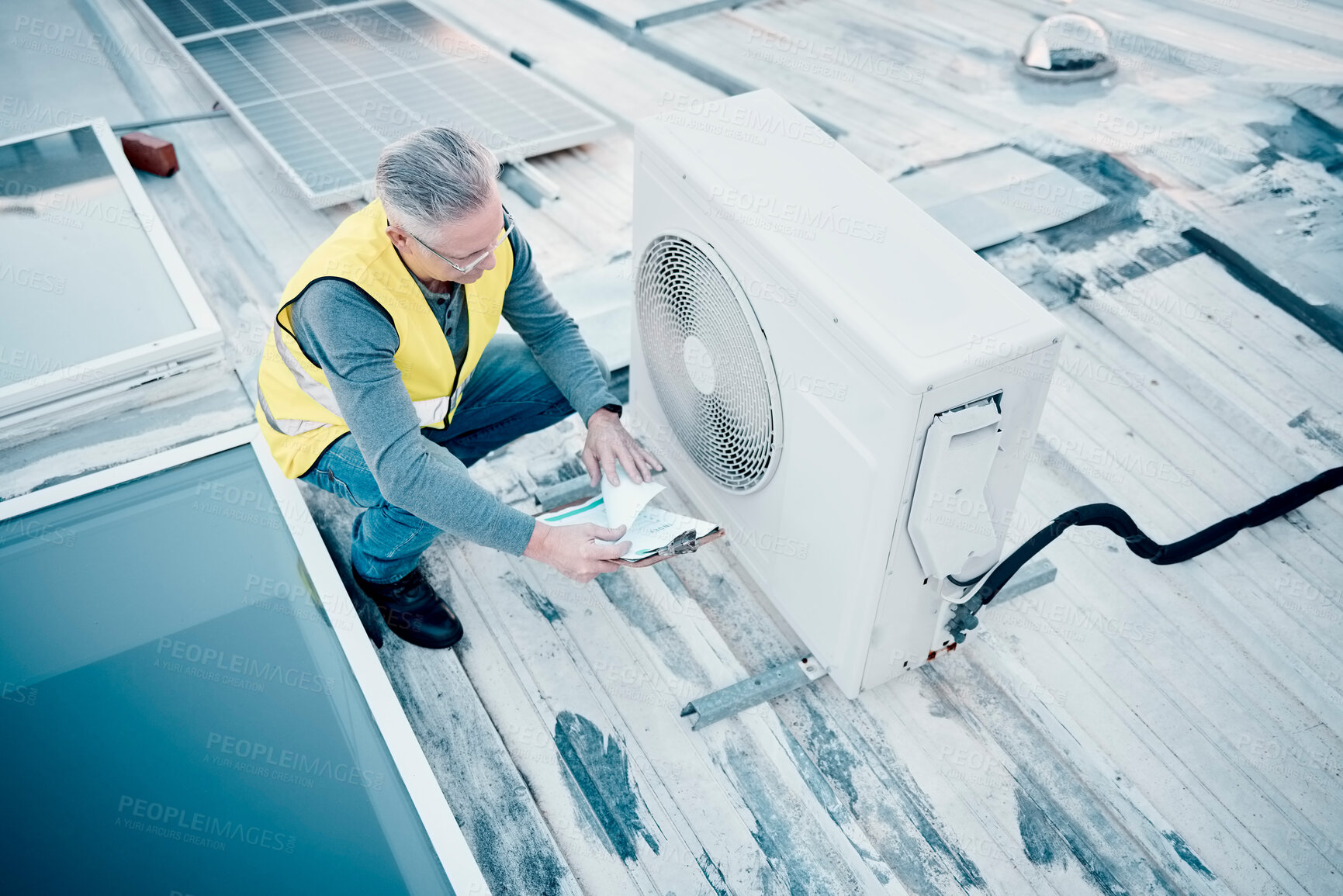 Buy stock photo Air conditioning, roof and engineering man for maintenance, inspection and solar panel in sustainability. Technician planning energy saving power, aircon installation and generator electrician check