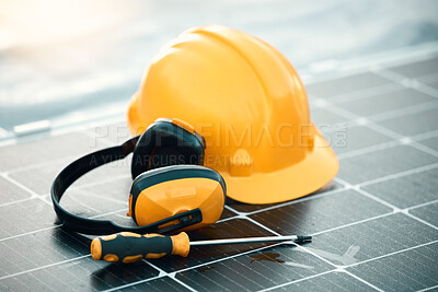 Buy stock photo Solar panel maintenance, tools and outdoor by helmet, headphones or renewable energy by blurred background. Photovoltaic tech goals, sustainability vision and eco friendly electricity by screwdriver