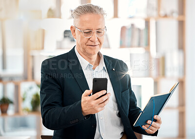 Buy stock photo Notebook, phone and senior business man in office for client contact, reading directory and planning schedule. Social media, networking and ceo on smartphone for mobile app, writing email and text