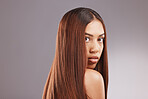 Black woman, hair care and studio portrait for healthy shine, beauty and wellness by gray background. Young gen z model, girl and cosmetics for growth, keratin health and aesthetic with confidence