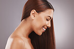 Salon, beauty and hair with a model black woman in studio on a gray background for natural treatment. Aestehtic, face and haircare with an attractive young female posing to promote keratin benefits
