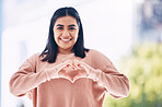 Heart hands, portrait and happy woman for self care, cardiology wellness and gen z support for women health. Face of a young Indian person with love emoji, sign or gesture for like, vote and smile