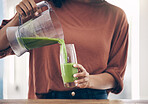Green, smoothie and hands of woman with a drink in the kitchen for breakfast, detox and diet. Hand, nutritionist and lady with fresh, weight loss and healthy, raw and vegan lifestyle, shake and juice