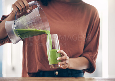 Buy stock photo Green, smoothie and hands of woman with a drink in the kitchen for breakfast, detox and diet. Hand, nutritionist and lady with fresh, weight loss and healthy, raw and vegan lifestyle, shake and juice