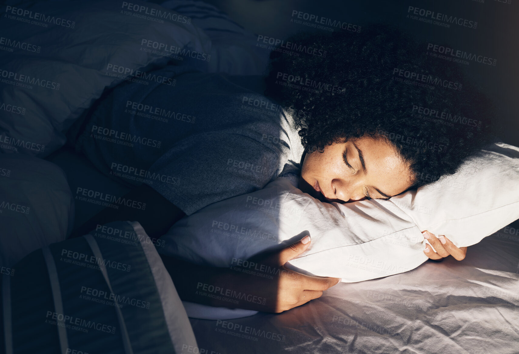 Buy stock photo Black woman, bed and sleeping at night for peace, quiet and rest or relax in home bedroom. Person with pillow to dream, security or for calm sleep with nap or comfort with duvet for wellness