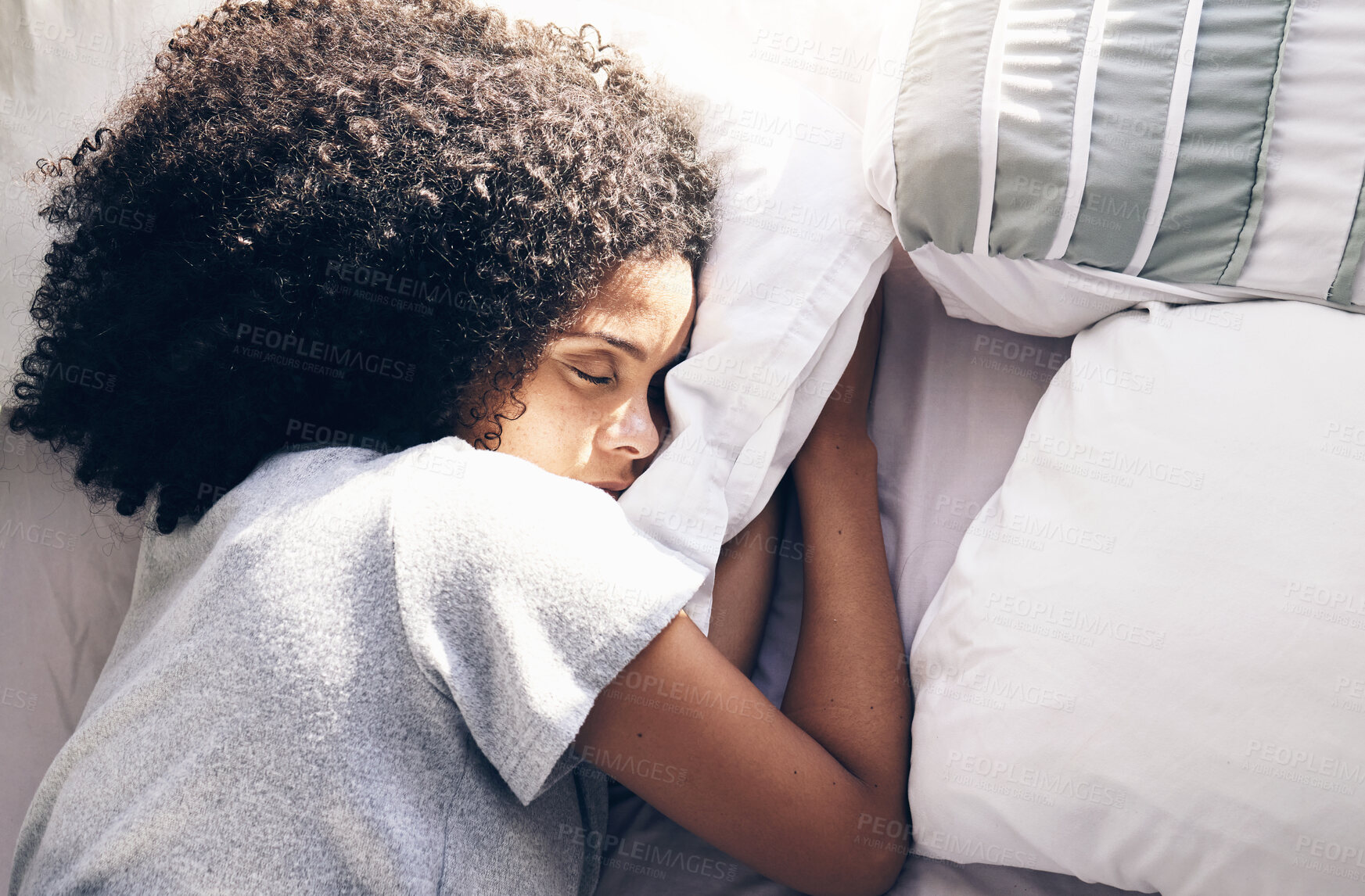 Buy stock photo Sleeping, bedroom and relax with a black woman in bed, dreaming or resting in the morning at home. Sleep, tired and rest with an attractive young female asleep in her house over the weekend