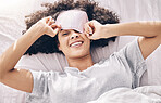 Sleeping, wake up and black woman with eye mask in bed, dream and refresh body and mind in apartment or hotel. Dreaming, rest and relaxation, smile and beauty sleep late on weekend morning in bedroom