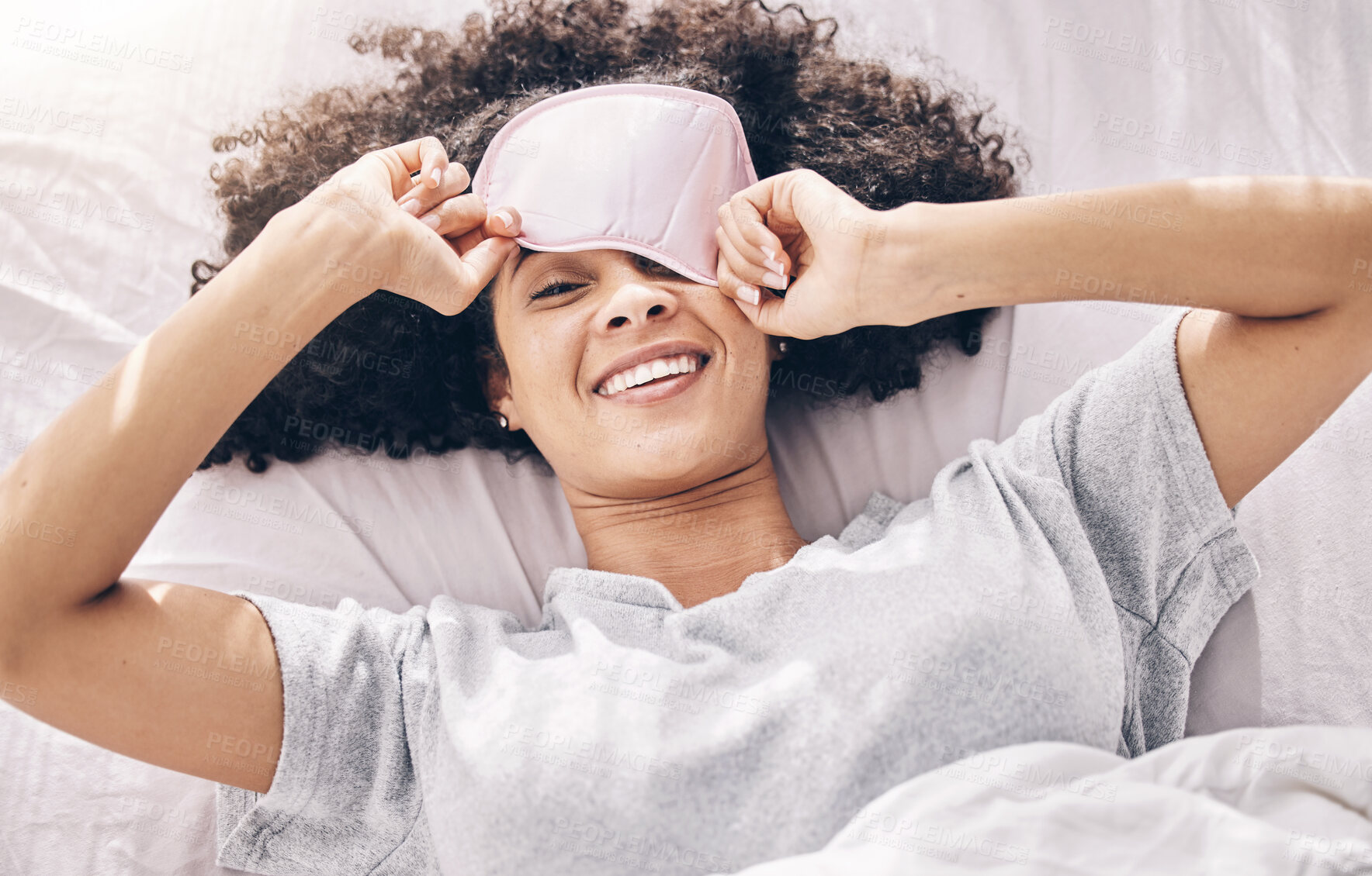 Buy stock photo Sleeping, wake up and black woman with eye mask in bed, dream and refresh body and mind in apartment or hotel. Dreaming, rest and relaxation, smile and beauty sleep late on weekend morning in bedroom