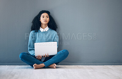 Buy stock photo Laptop, relax and thinking with black woman on floor and wall mockup for social media, news or website. Design, online shopping and technology with girl for communication, internet or advertising