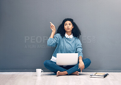 Buy stock photo Laptop, research and pointing with black woman on floor with mockup for social media, news or deal. Offer, online shopping and technology with girl customer for communication, internet or advertising
