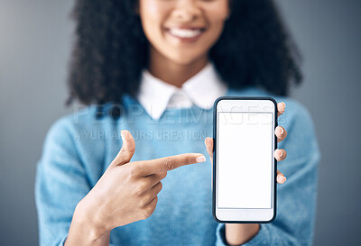 Buy stock photo Mockup screen, smartphone or black woman pointing hand at digital marketing, branding or advertising content. Startup, web or girl in studio with phone for product space, internet or social media 