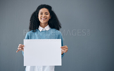 Buy stock photo Mockup, portrait and black woman with poster for space, advertising sign and branding on grey background. Face, blank or billboard by girl relax on mock up, copy or announcement on product placement