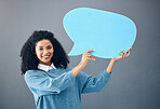 Portrait, black woman and speech bubble in studio on news, mockup or advertising on grey background. Face, girl or banner, poster or sign on product placement, isolated on blank billboard copy space