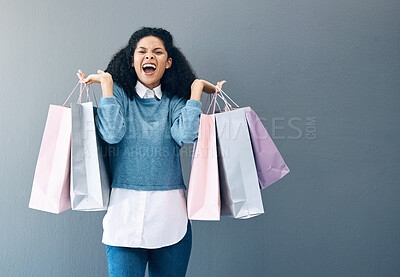 Buy stock photo Shopping, black woman excited and scream portrait of a happy customer with bags after shop sale. Isolated, gray background and female smile in a studio holding a bag with discount market product