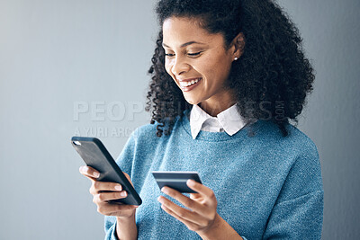 Buy stock photo Online shopping, credit card and woman with phone in studio for advertising on grey background. Ecommerce, banking and finance payment with app, transfer or savings on mockup or isolated copy space
