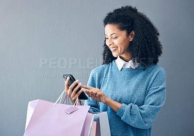 Buy stock photo Shopping bag, phone or black woman in mockup studio for fashion sale, discount or luxury brand store. Happy or girl smile on smartphone for social media, promo code or online retail internet app news