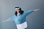 Metaverse, virtual reality headset and gaming woman with hands for 3d flying game in studio. Gamer person vr headset for digital world, futuristic gaming and ar tech ux experience on grey background