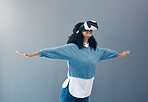 Woman, virtual reality glasses and metaverse with mockup space and hands for 3d flying game in studio. Gamer person vr headset for digital experience, futuristic gaming and ar tech on grey background
