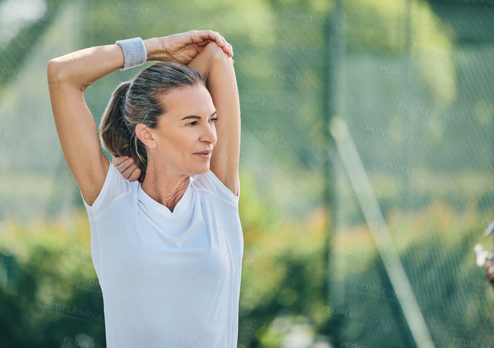 Buy stock photo Tennis, mock up and stretching with a sports woman on a court for a warm up before her competitive game. Sport, fitness and training with a senior female athlete getting ready for a practice match