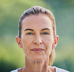 Beauty, portrait and mature woman in nature for health, wellness or fresh air in summer. Beautiful, headshot and senior female model from Australia standing in a green garden, park or field.