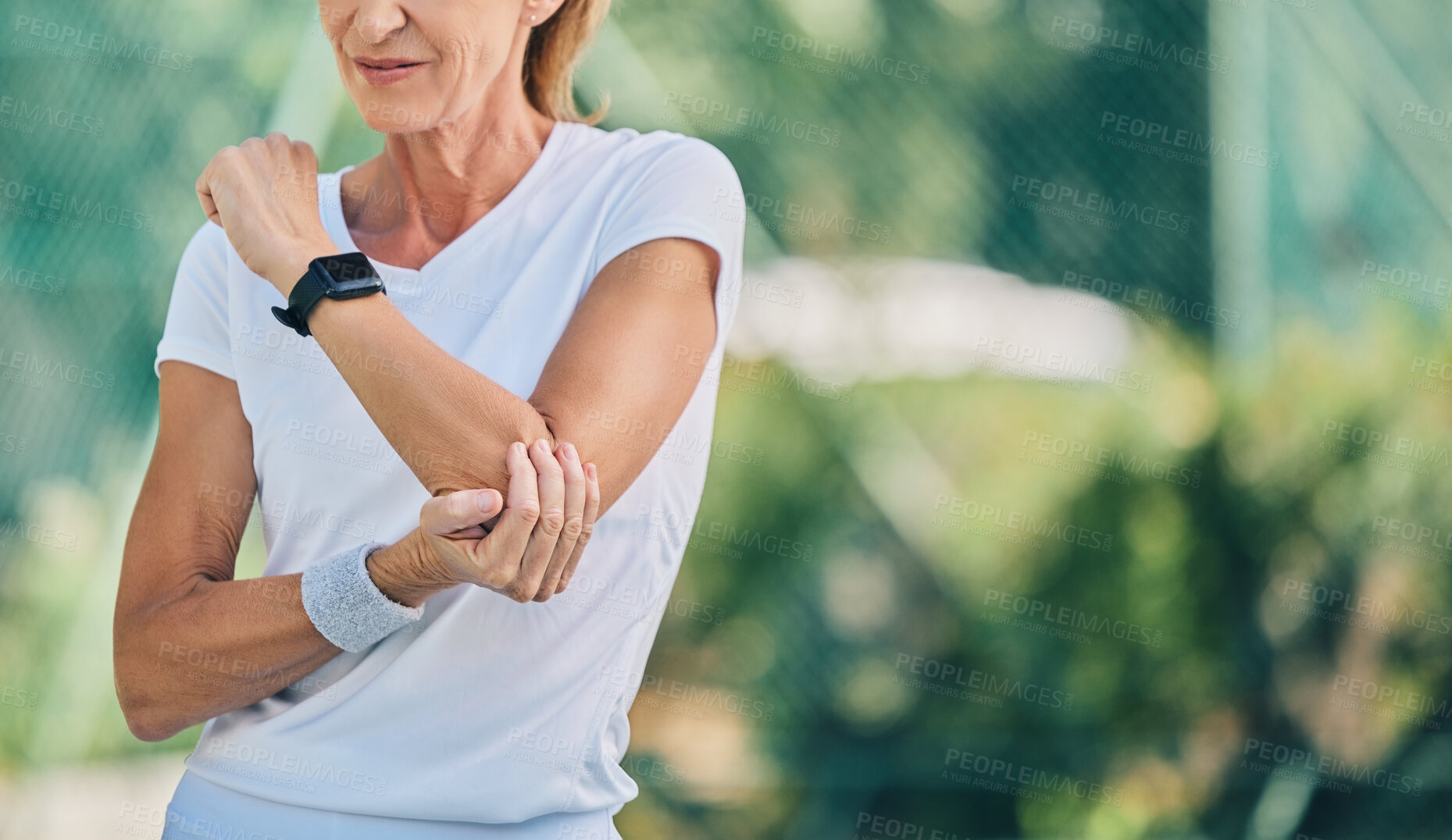 Buy stock photo Fitness, arm pain and tennis training with a mature woman on a outdoor court with mockup and injury. Fitness, wellness and workout inflammation of a athlete with joint and muscle problem from sport