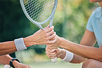 Hands together, tennis racket and coach with woman athlete, support and helping hand at training. Women, coaching and learning for sports, goals and motivation by blurred background outdoor for goal