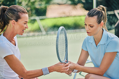 Buy stock photo Women hands together, tennis racket and coach with athlete, support or helping hand at training. Woman, coaching and learning for sports, teaching or advice by blurred background outdoor for strategy