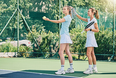 Buy stock photo Tennis training, sport and women athlete on outdoor turf, instructor or coach with fitness, motivation and help. Exercise, sports lesson and workout together, teaching and learning skill on court