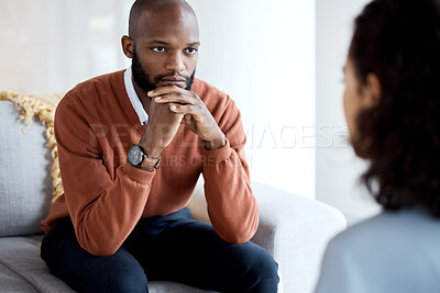 Buy stock photo Mental health, depression and black man with a therapist for grief, depression or anxiety counseling. Psychology, sad and professional psychologist helping a African male patient in a clinic session.