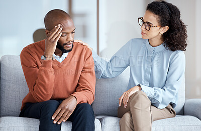 Buy stock photo Therapy, counselling and mental health support for black man patient on psychologist couch. Person talking to woman therapist about psychology, anxiety and depression or stress for help or support 