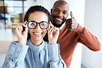 Glasses, portrait and woman with a thumbs up from an optician for the choice of frame in a store. Yes, agreement and girl with eyeglasses from a black man giving vision service with a hand sign