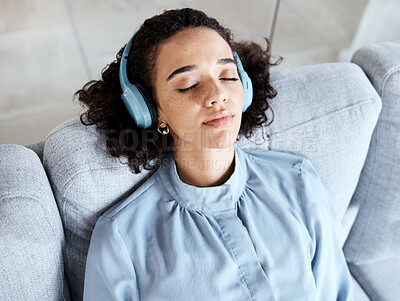 Buy stock photo Woman, face and headphones for listening to music for calm, peace and mindfulness on home couch. Young person on living room sofa listen to podcast, audio or motivation to relax or meditation above