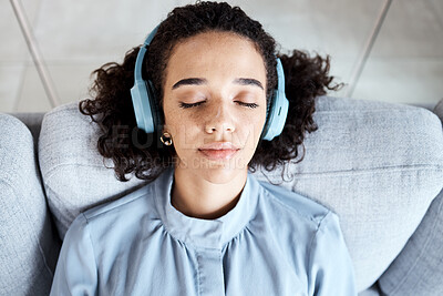 Buy stock photo Woman, face and headphones for listening to music for calm, peace and mindfulness on home couch. Young person on living room sofa listen to podcast, audio or motivation to relax or meditation above