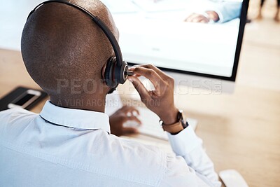 Buy stock photo Customer support, call center and back of a male consultant doing a consultation online in office. Contact us, career and African sales man or telemarketing agent working on crm strategy in workplace