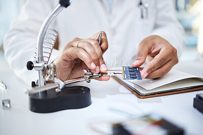 Buy stock photo Hands, microchip and engineering woman with magnifying glass of science, maintenance and laboratory research. Technician, computer chip and hardware parts for electrical analysis of cpu investigation