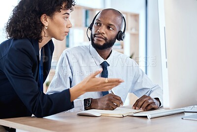 Buy stock photo CRM, customer service or teamwork writing notes for coaching, consulting or networking in office. Call center, learning or black man and woman on tech for telemarketing, research or strategy support